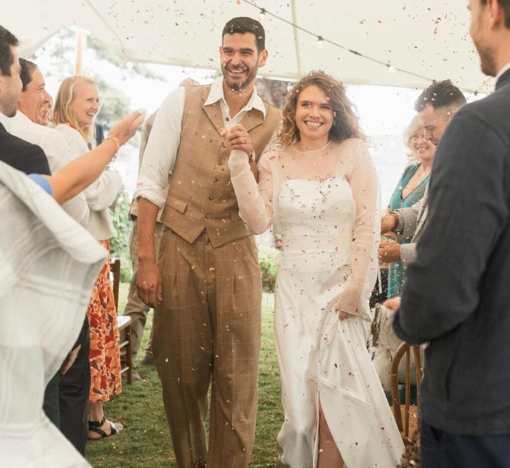 Nicôle Lecky's on-screen husband with his real wife.