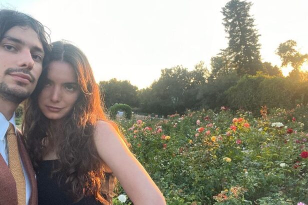 Dylan Gelula and her boyfriend Devon Bostick in a garden.