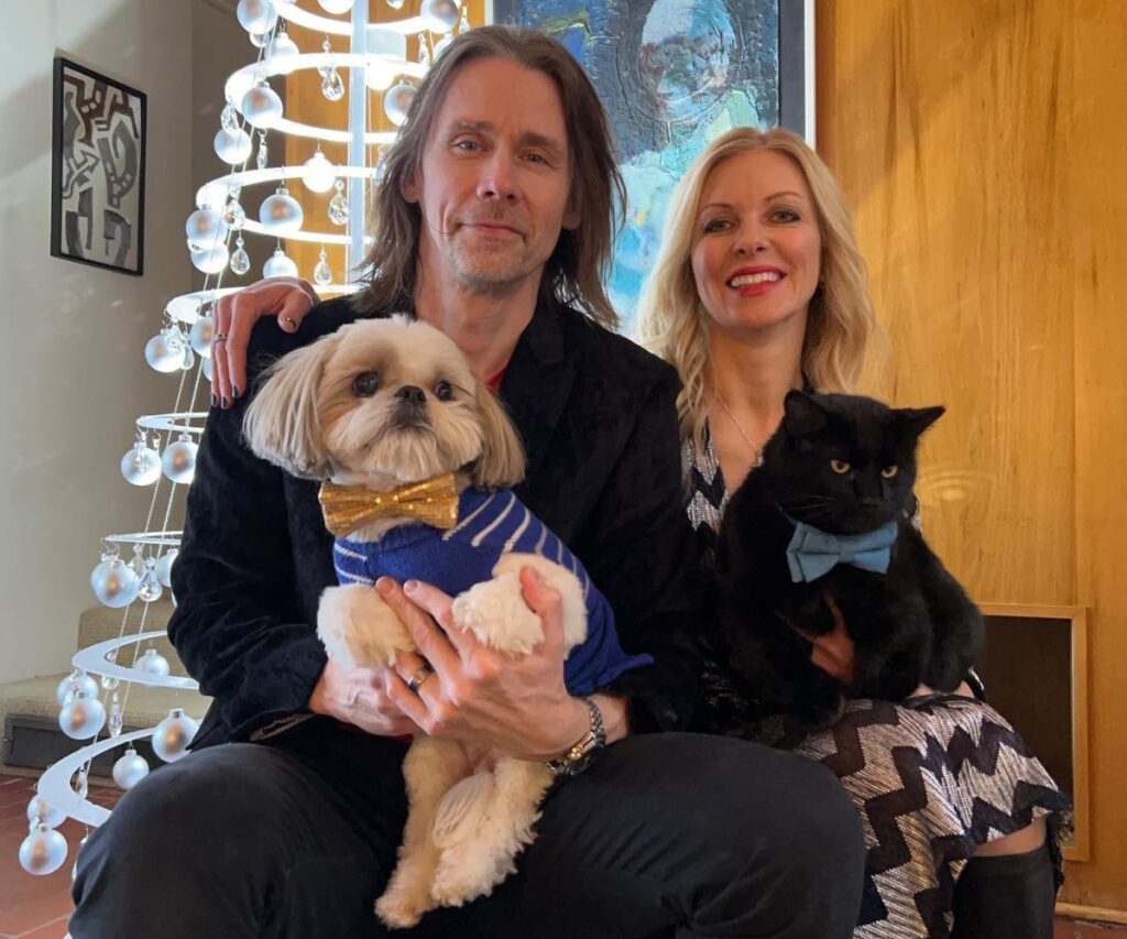 Myles Kennedy and his spouse with their dog and cat.