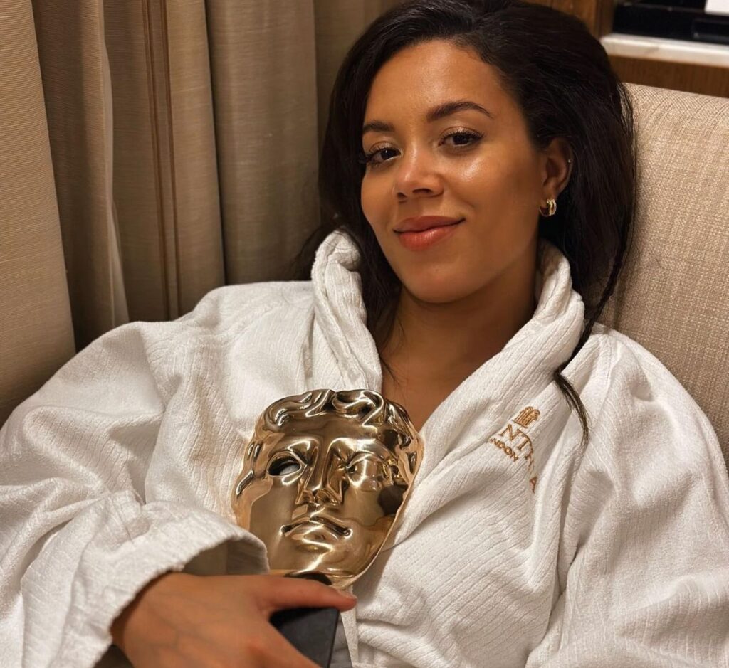 Nicôle Lecky holding her BAFTA award