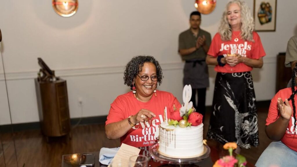 Kwame Onwuachi Chef Mother Jewel Robinson Cutting Birthday Cake.